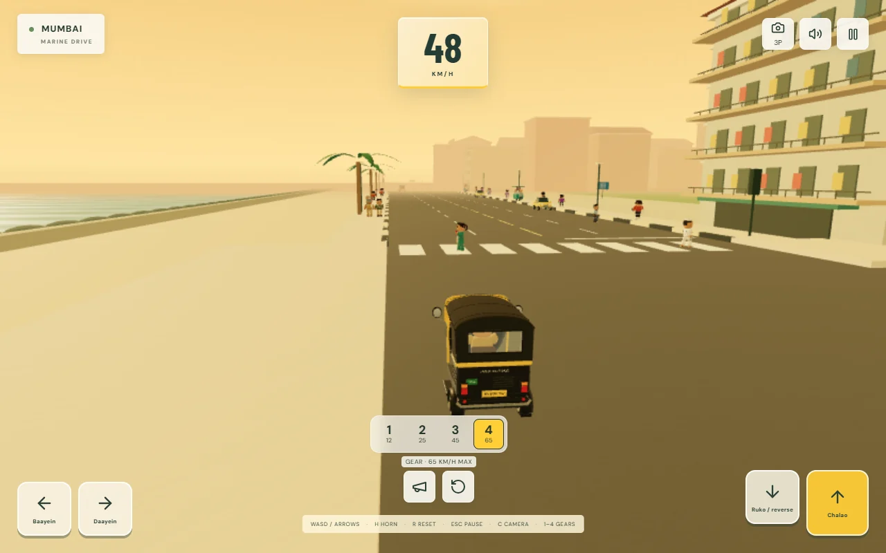 A black-and-yellow auto rickshaw beside the sea, with pedestrians and the four-gear driving controls visible